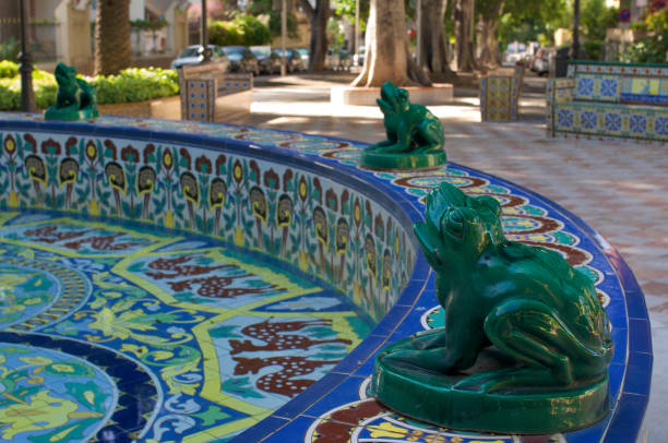 Green fountain frog spouting water