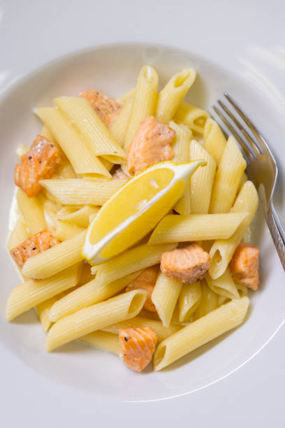 plate of pasta with smoked salmon, close-up