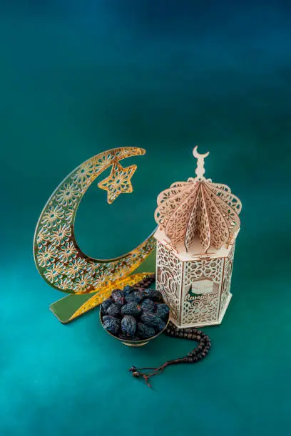 Islamic festival concept mage, Traditional lantern lamp with dates and crescent moon shape