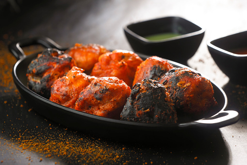Tandoori paneer momos are a delicious fusion of Indian and Tibetan cuisines.