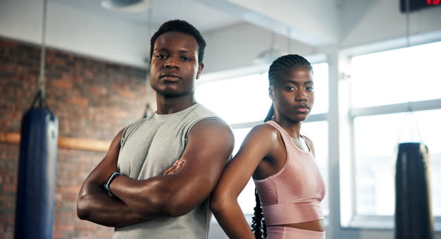 Gym, confident and black people serious for exercise, training or partner workout, challenge or teamwork. Portrait, athlete team and African bodybuilder fitness, mindset or boxing club development