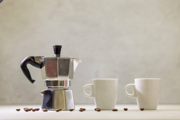 istock Metal geyser coffee maker on table with cup 1995530691