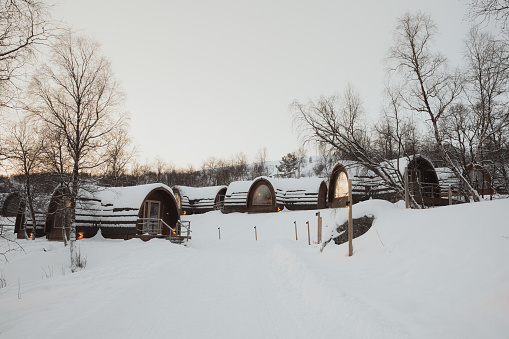 Cosy cabins in the snow in Kirkenes, Norway