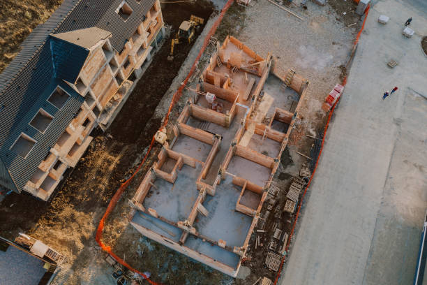 istock Aerial view of a new development area. Construction site. Cement and bricks structures 1995542631