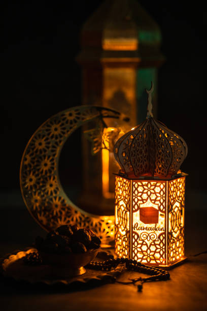 istock Iftar background dates on a golden bowl with Ramadan Lantern lamp 1995555295
