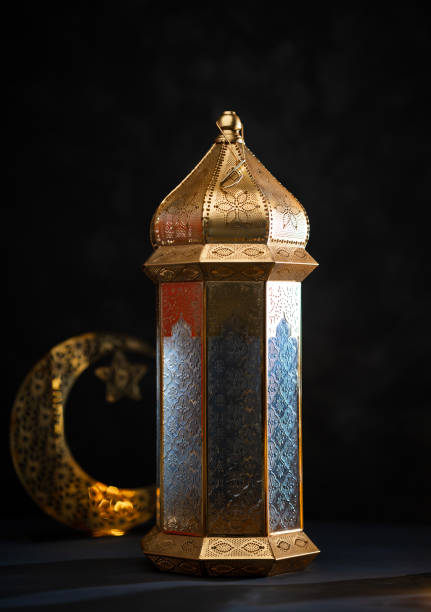 istock Big Moroccan lantern lamp isolated on dark background 1995557448