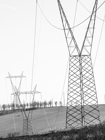 An image of electricity lines carrying power across the countryside of Leicestershire, England, UK