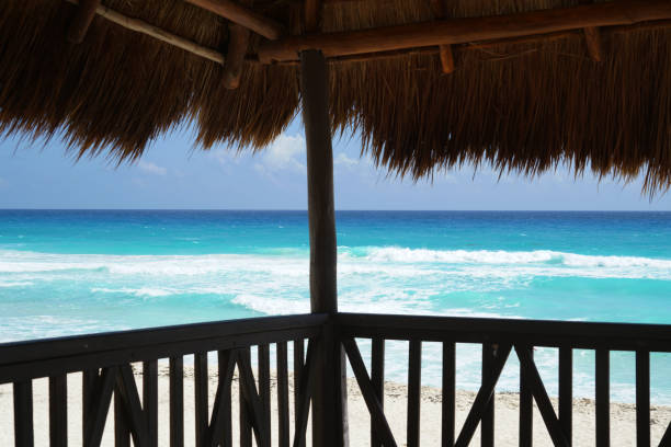 Lounge Chair at Ocean Edge on White Sand Beach in Caribbeans