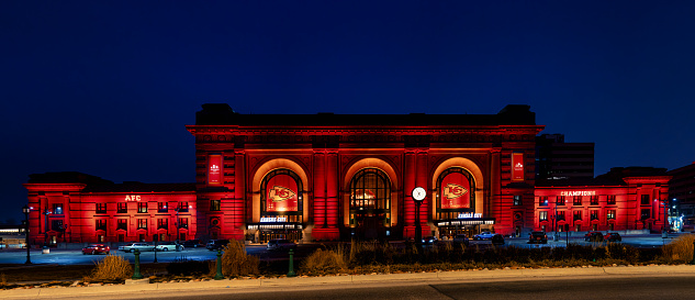 Kansas City, United States – February 03, 2024: A spacious structure adorned with vibrant neon lights, including captivating red window illumination