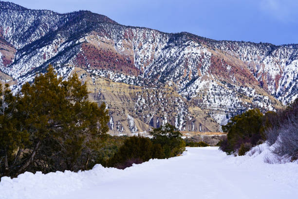 istock Snowy Backcountry Mountain Road with Nobody 1995648142