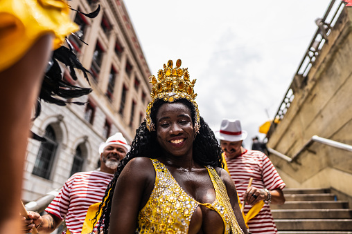 Portrait of a mid adult woman having fun at a street carnival party