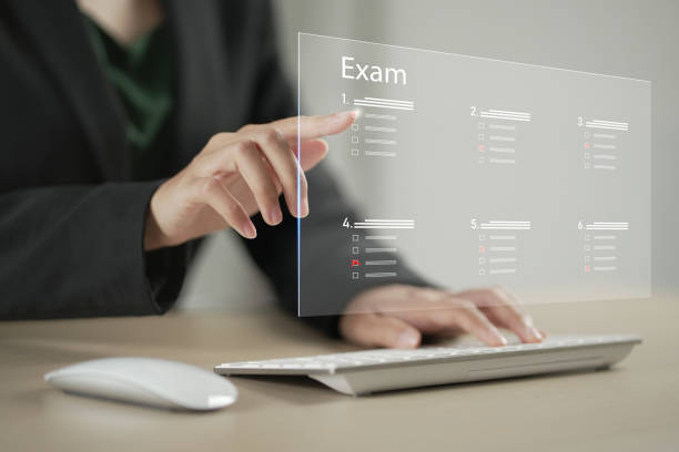 istock student passing online exam concept. Virtual test or questionnaire show on screen and answer check mark to measure grades. Education 1995675455