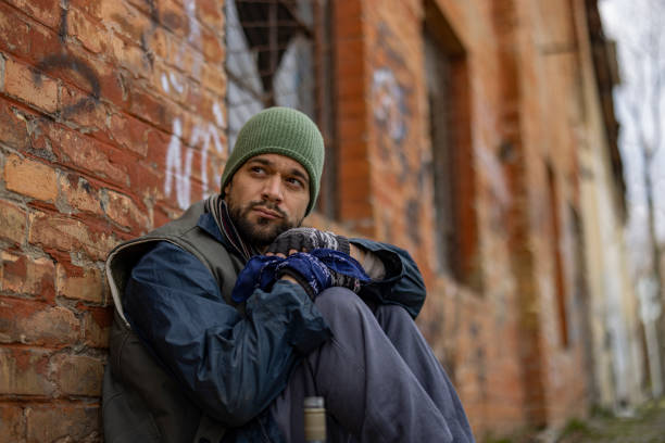 istock Homeless Man Sitting Outdoors 1995704865