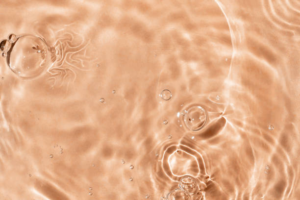 istock Textured water background with large bubbles and sun glare 1995732700