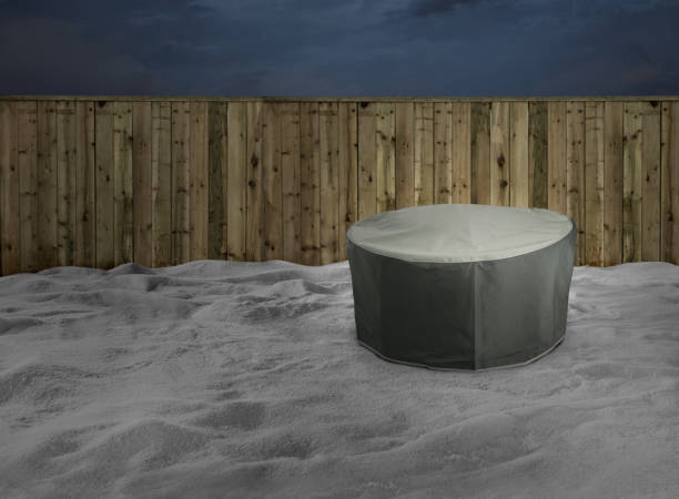 istock hot tub or patio covered with a protector in a backyard with a snow 1995736331