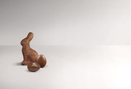 Chocolate Easter bunny and chocolate eggs on a white background