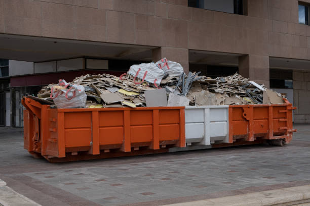 istock huge heap on metal Big  Overloaded dumpster waste container filled with construction waste, drywall and other rubble near a construction site. 1995771619