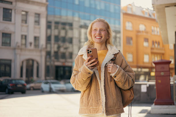 istock Young woman using mobile phone 1995790250