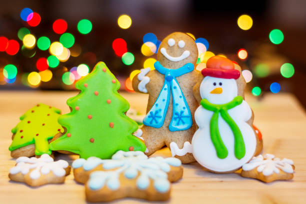 istock Gingerbread man cookie on Christmas lights 1995800681