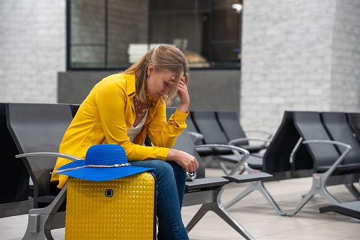 Woman missed her flight or it was cancelled.