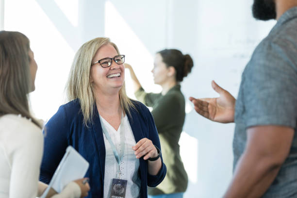 istock Female professor talks to students in continuing ed class 1995828627