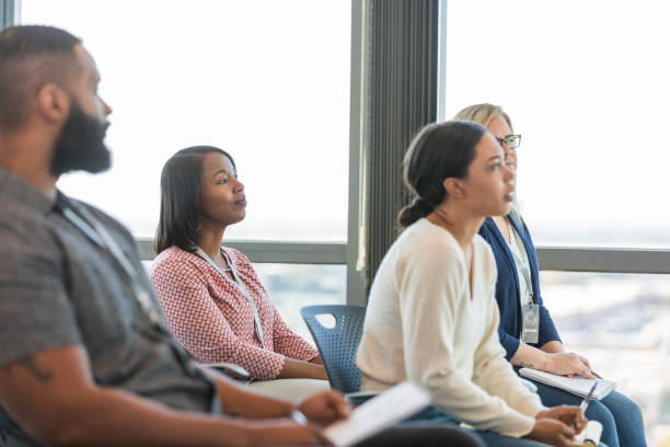 istock Diverse business professionals attend seminar on university campus 1995828628