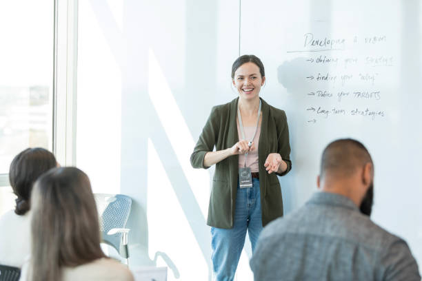 istock Female presenter looks at audience expectantly 1995829178