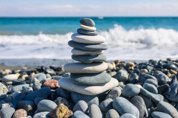 istock Zen stone pyramid on sea beach 1995830246