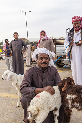 Middle East, Saudi Arabia, Al-Qassim, Buraydah. November 13, 2023. Saudi men at the Al Qassim livestock market.