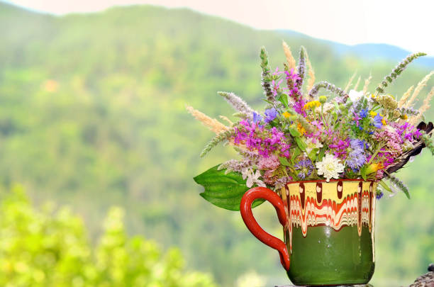 Vase with colorful wild spring flowers