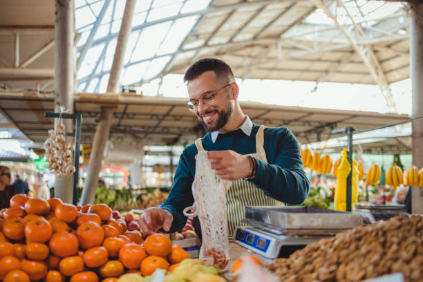 istock Stall Holder Working at Farmer's Market 1995854985