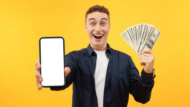 istock Excited young guy holding big smartphone with white blank screen 1995892291