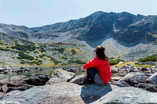 Traveler  Woman  in the summer  mountain . Pirin Mountain  , Bulgaria