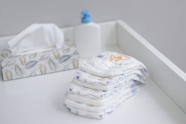 istock A stack A stack of diapers and baby supplies on white changing table 1995892848