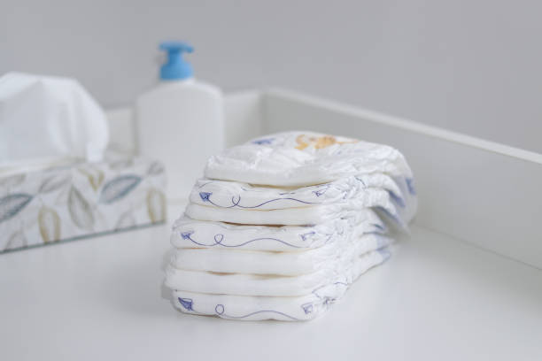istock A stack A stack of diapers and baby supplies on white changing table 1995893393