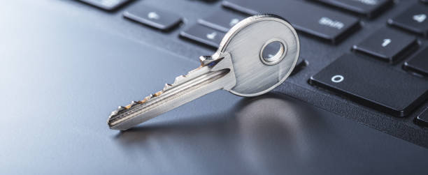istock phishing, hacking personal data and money , key and hook on computer keyboard. 1995896631