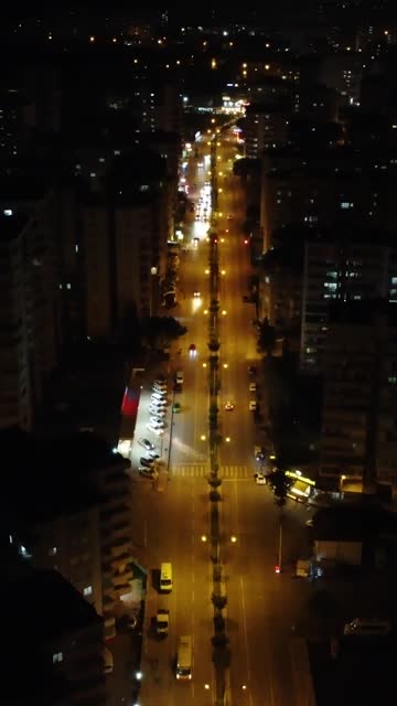 Night city, darkness contrasts with vibrant lights in Mersin, night city, darkness unveils urban beauty, night city, darkness pierced by glowing streets