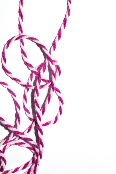 istock Wrapping Paper Stripy String Rope Close Up on White Background 1995930006