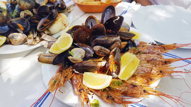 istock Shrimps and shellfish cooked with parsley, garlic and lemon 1995940982