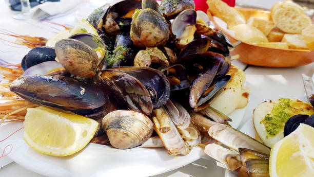 istock Shrimps and shellfish cooked with parsley, garlic and lemon 1995941512