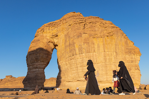 Middle East, Saudi Arabia, Medina, Al-Ula. November 17, 2023. Arab women tourists wearing niquabs at Elephant Mountain.