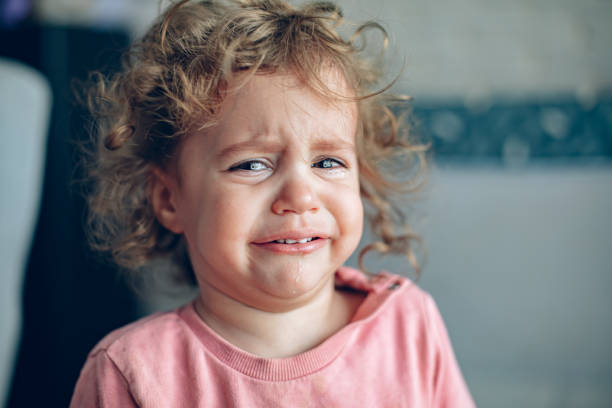 istock Frustrated baby girl crying 1995950571