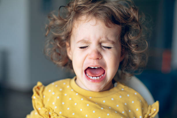 istock Frustrated baby girl crying 1995953724