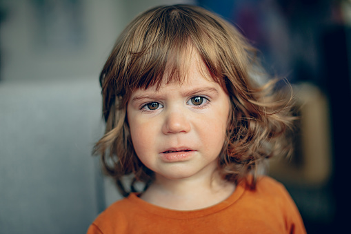 Close up portrait of crying little toddler boy