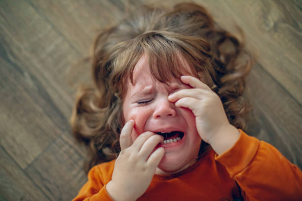 istock Little toddler boy having a tantrum 1995961029