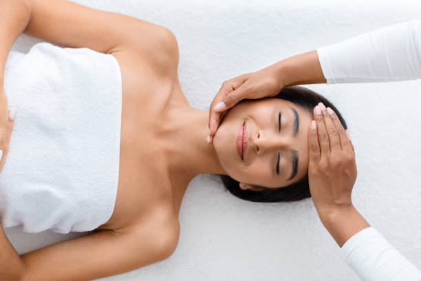 istock Masseuse making relaxing massage for young beautiful indian lady 1996004227