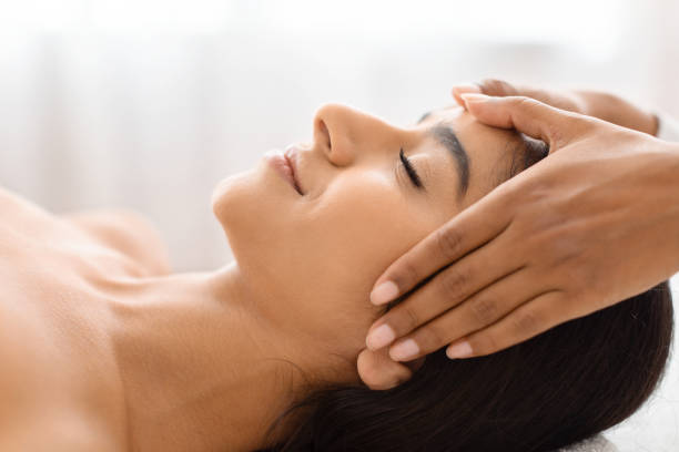 istock Tranquil beauty with a soothing head rub in a wellness center 1996004738