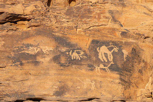 Rock carvings depicting characters and figures dating back to the talmudic period. Photographed in the desert close to Taima and Tabuck in Saudi Arabia