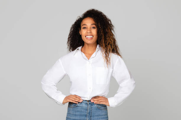 istock african lady holding hands on hips standing with confidence, studio 1996051079