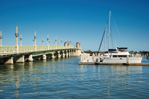 St Augustine Florida Bridge of Lions Sailboat Sailboat and the Bridge of Lions in St Augustine, Florida USA bridge of lions stock pictures, royalty-free photos & images